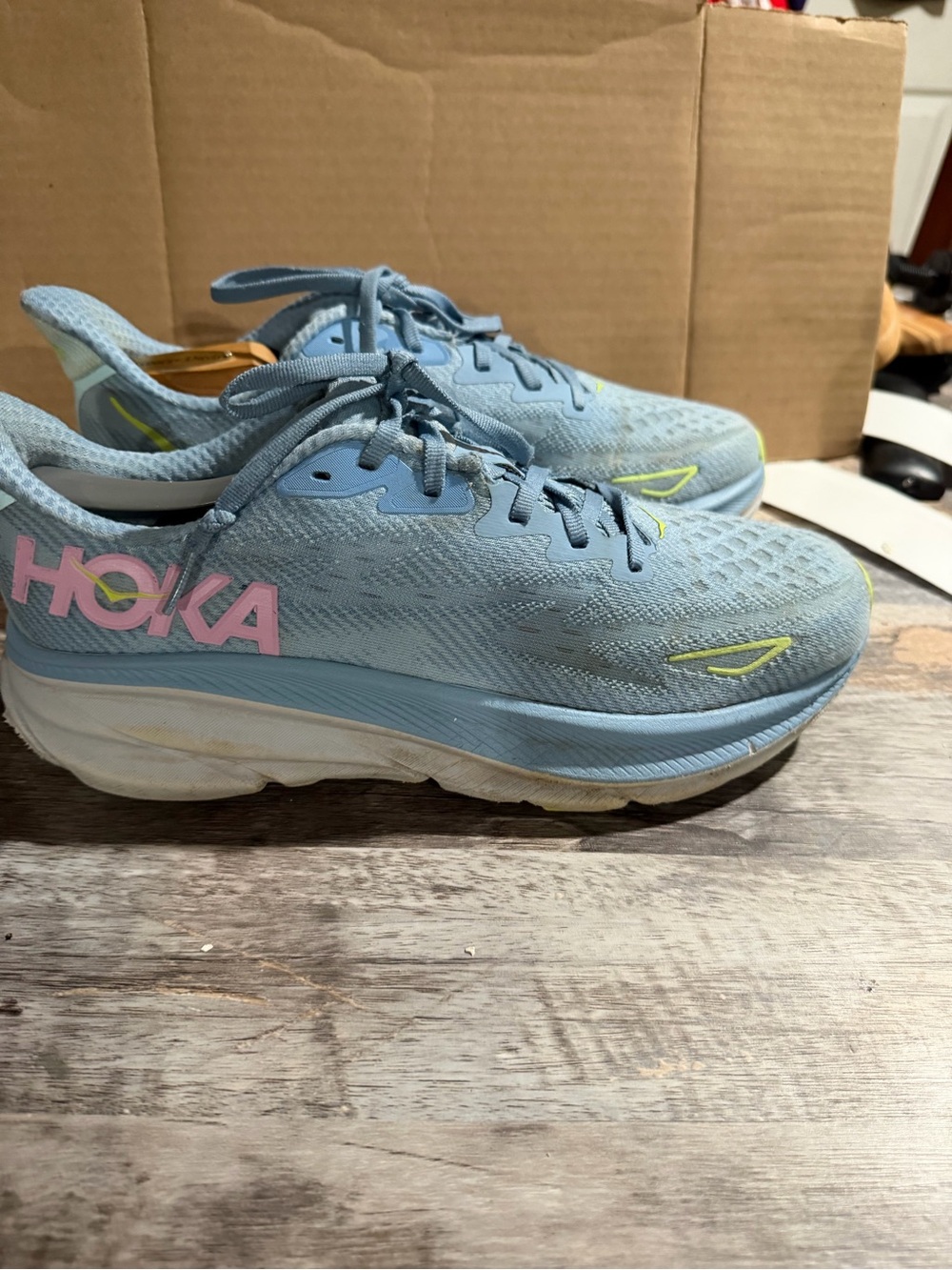 Hoka Women's Sky Blue Running Shoes with Pink Logo and Yellow Accents